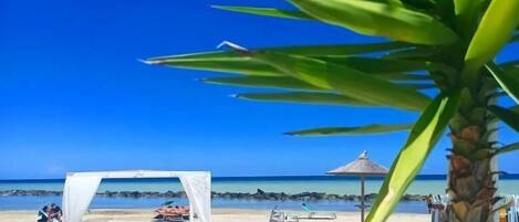 Private beach, white sand, beach umbrellas, beach towels