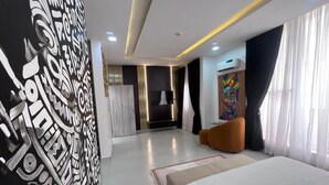 A modern hotel room with a large bed, a wall with abstract art, a painting, and a large window with curtains. - LUXURY 4BED APARTMENT IKOYI (Lagos)