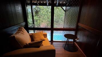 Deluxe Chalet | Living area | 55-inch Smart TV with digital channels