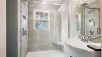 Shower, hair dryer, towels, shampoo