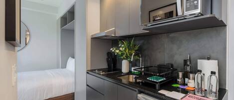 Fridge, microwave, stovetop, coffee/tea maker