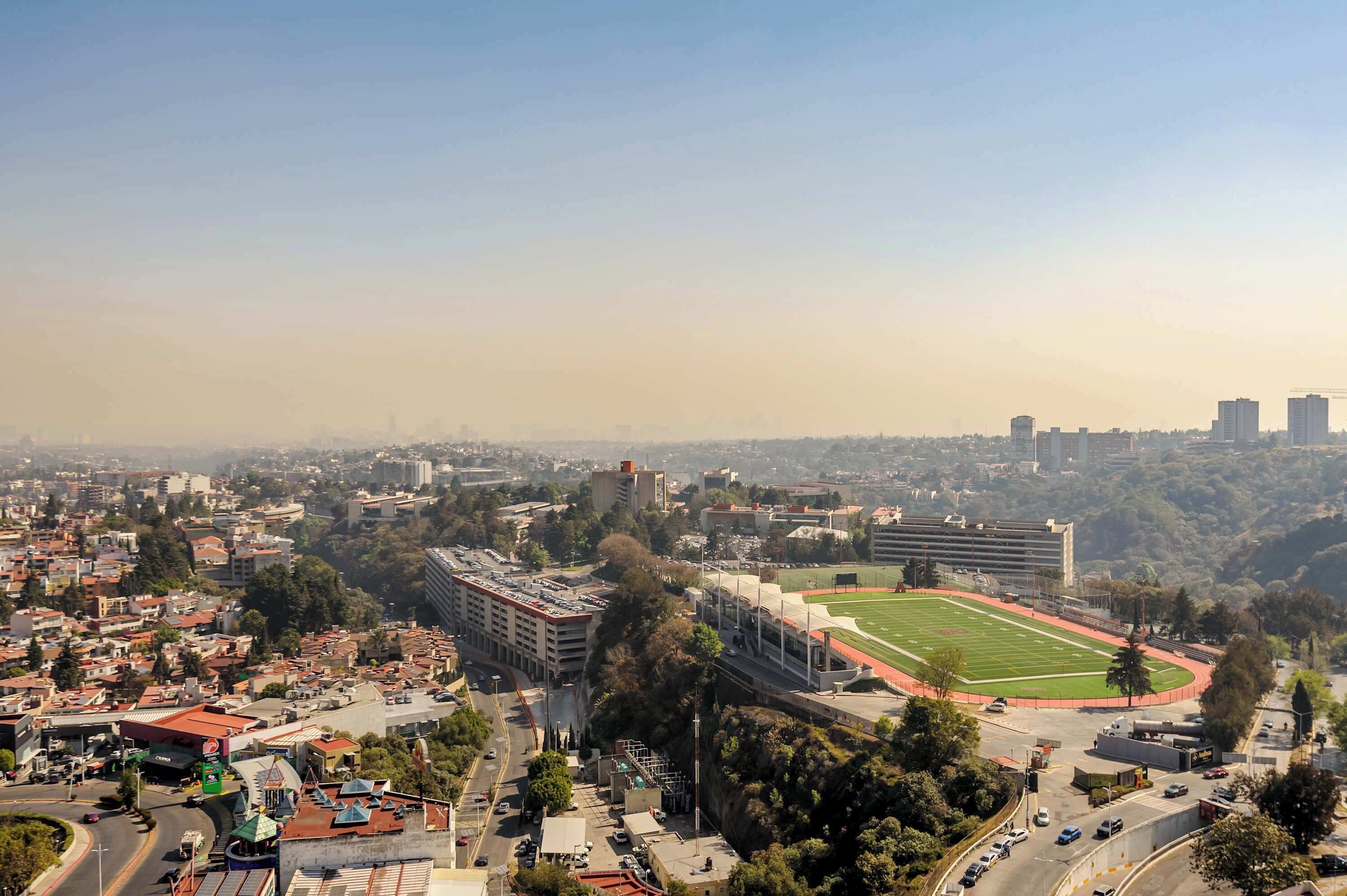 A stadium surrounded by urban buildings and roads.