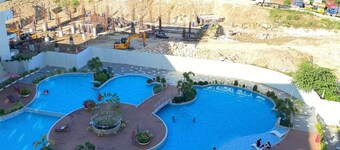 Cozy 1-bedroom condo in peaceful Lapu-Lapu with AC and gym access