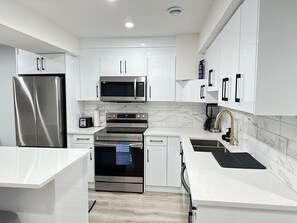 Unclassified image, 4 of 31, button - Modern 2 Bedroom Suite (Airdrie)