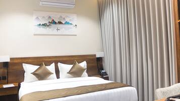 Premium bedding, blackout curtains, soundproofing, iron/ironing board