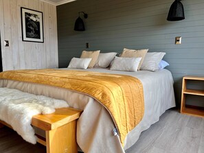 In-room safe, desk, laptop workspace, blackout curtains - Pampa Lodge (Torres del Paine)