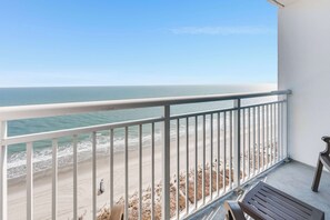 A balcony with a view of the beach and ocean. - Honeymoon Suite with Direct Oceanfront View,Pools! (Myrtle Beach)