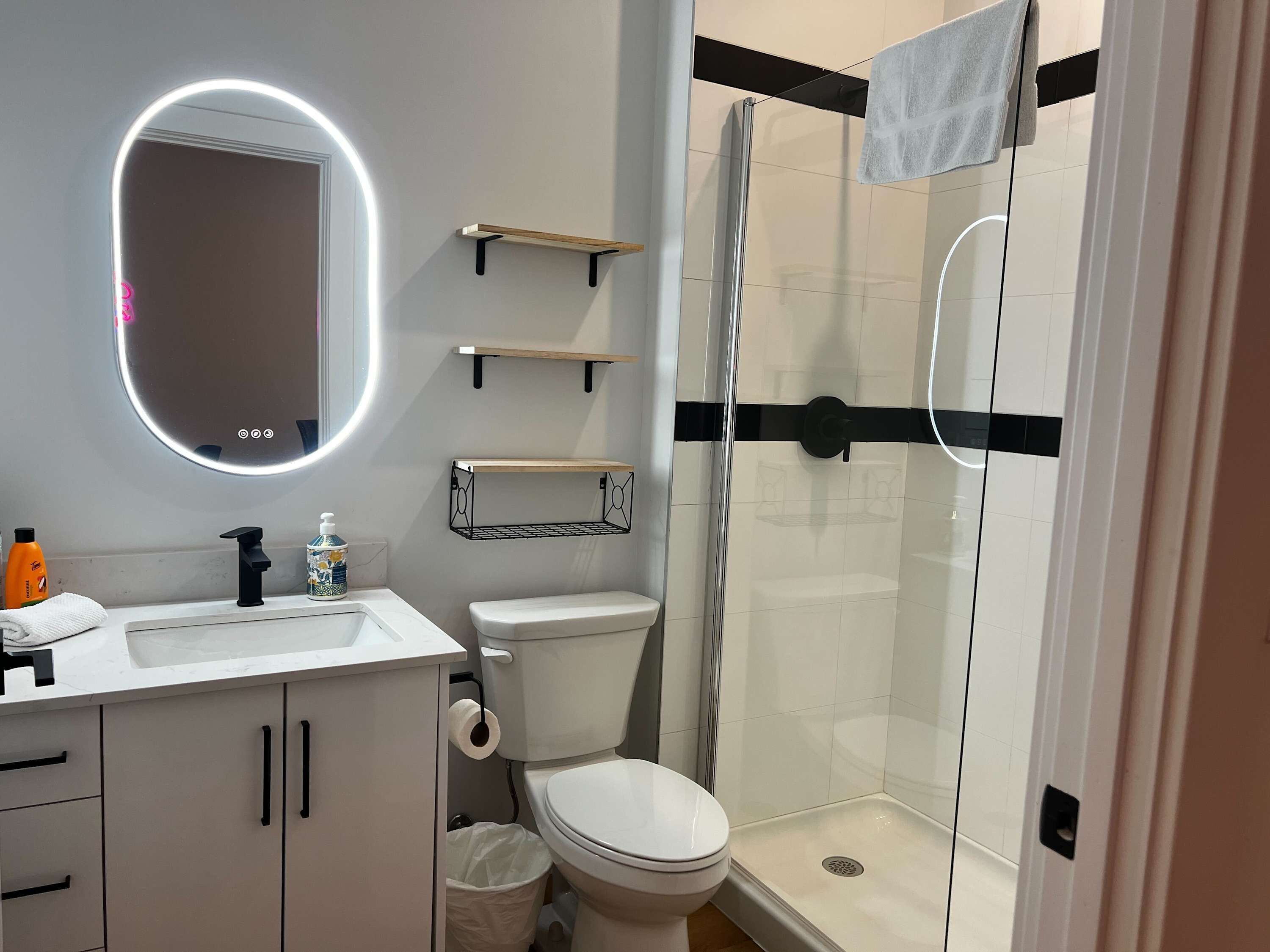 Shower, hair dryer, towels, shampoo