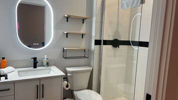 Shower, hair dryer, towels, shampoo