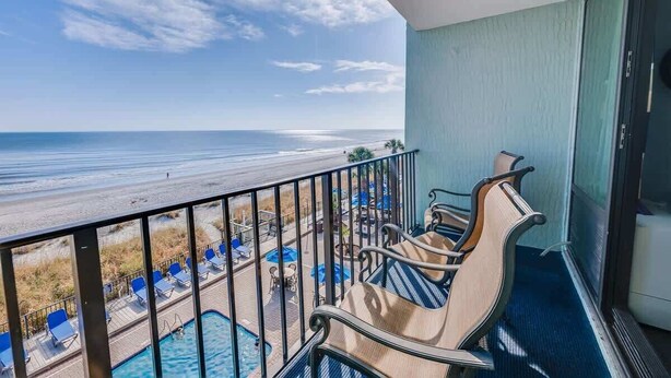 A balcony with a view of the beach and pool area. - Great Direct Oceanfront View,Low Floor,Heated Pool (Myrtle Beach)