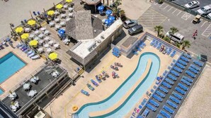 An aerial view of a hotel with a swimming pool, sun loungers, and outdoor seating areas. - Direct Oceanfront 1BR, Pools at Sands Ocean Annies (Myrtle Beach)