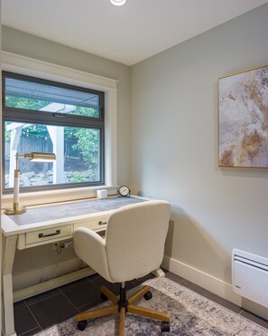 A study room with a desk, chair, window, and radiator. - Family Home w/ Kayaks, Hot Tub, Beach Access & Pickleball (Eastsound)