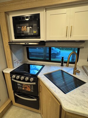 Unclassified image, 4 of 12, button - RV Park experience - Modern 2026 RV (Pompano Beach)