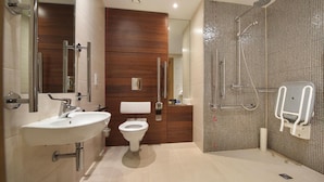 A modern bathroom with a sink, toilet, and shower. - Bicester Country Club (Bicester)