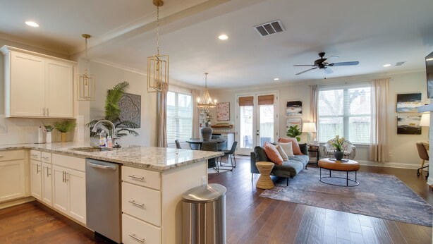 A spacious kitchen with a large island, a dining area with a table and chairs, a living room with a sofa and coffee table, and a ceiling fan. - Pool Table! Walkable Stay in Midtown MEM (Memphis)