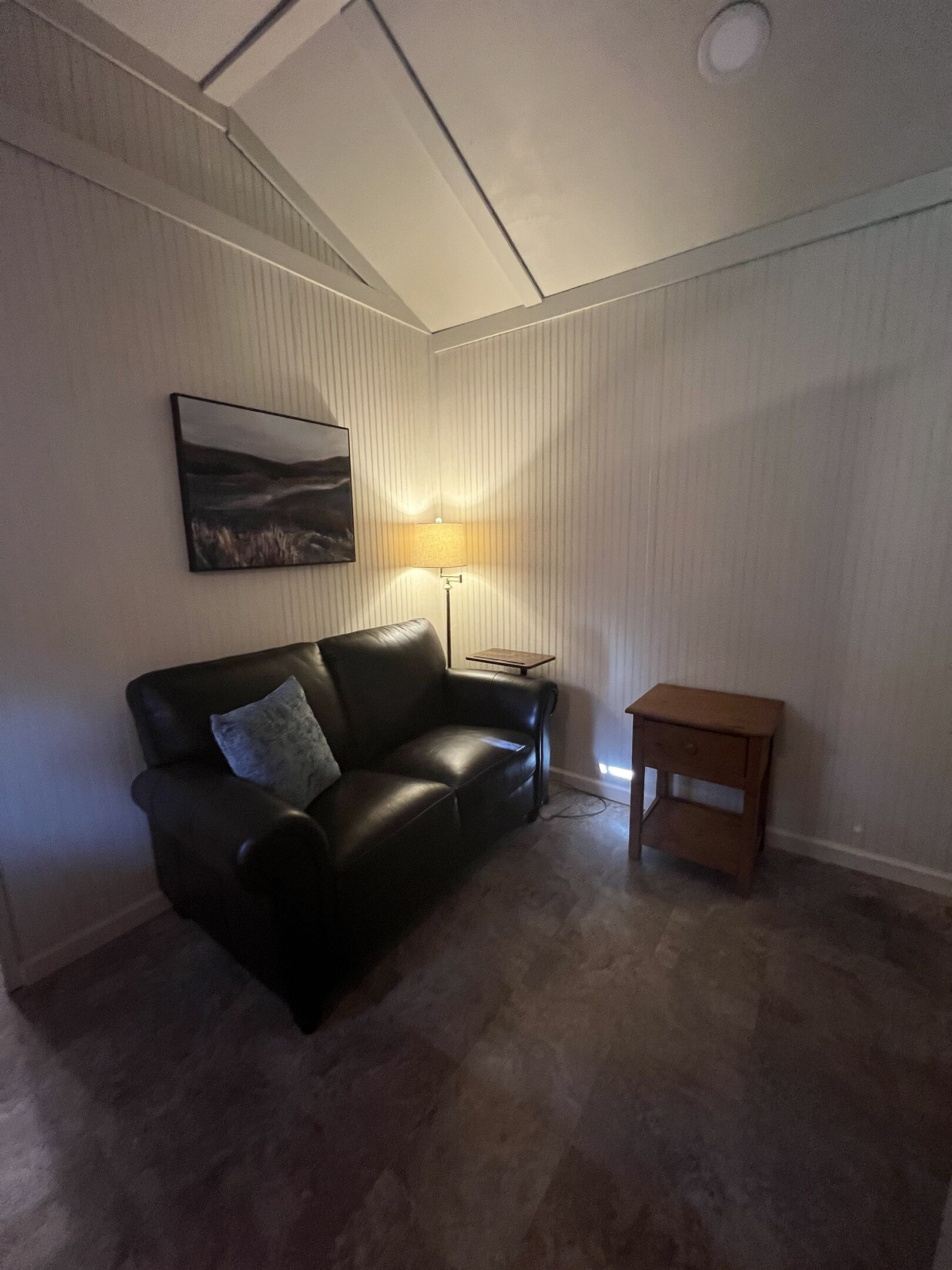 Comfortable love seat faces the Smart TV.