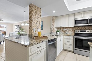 Fridge, microwave, oven, stovetop - Sunny Oceanfront Condo w/ Private Balcony, Heated Pool, BBQ Grills! ☀️ (Cocoa Beach)