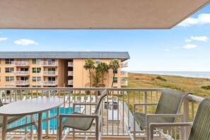 Outdoor dining - Sunny Oceanfront Condo w/ Private Balcony, Heated Pool, BBQ Grills! ☀️ (Cocoa Beach)