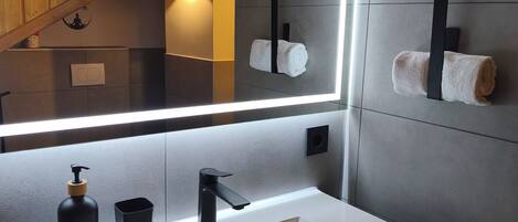 Shower, hair dryer, towels, soap