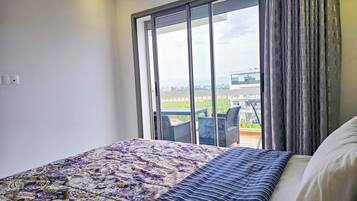 Deluxe Apartment, Pool View | Iron/ironing board, free WiFi