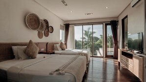 A modern hotel room with two beds, a flat-screen TV, and a balcony with a view of palm trees. - Nara Villa Canggu By Ini Vie Hospitality (Payangan)