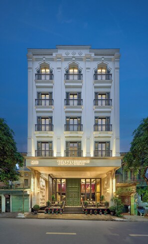 A multi-story building with a grand entrance, balconies, and a sign indicating it is a luxury boutique hotel and spa. - Tonkin Luxury Boutique Hotel & Spa (Hanoi)