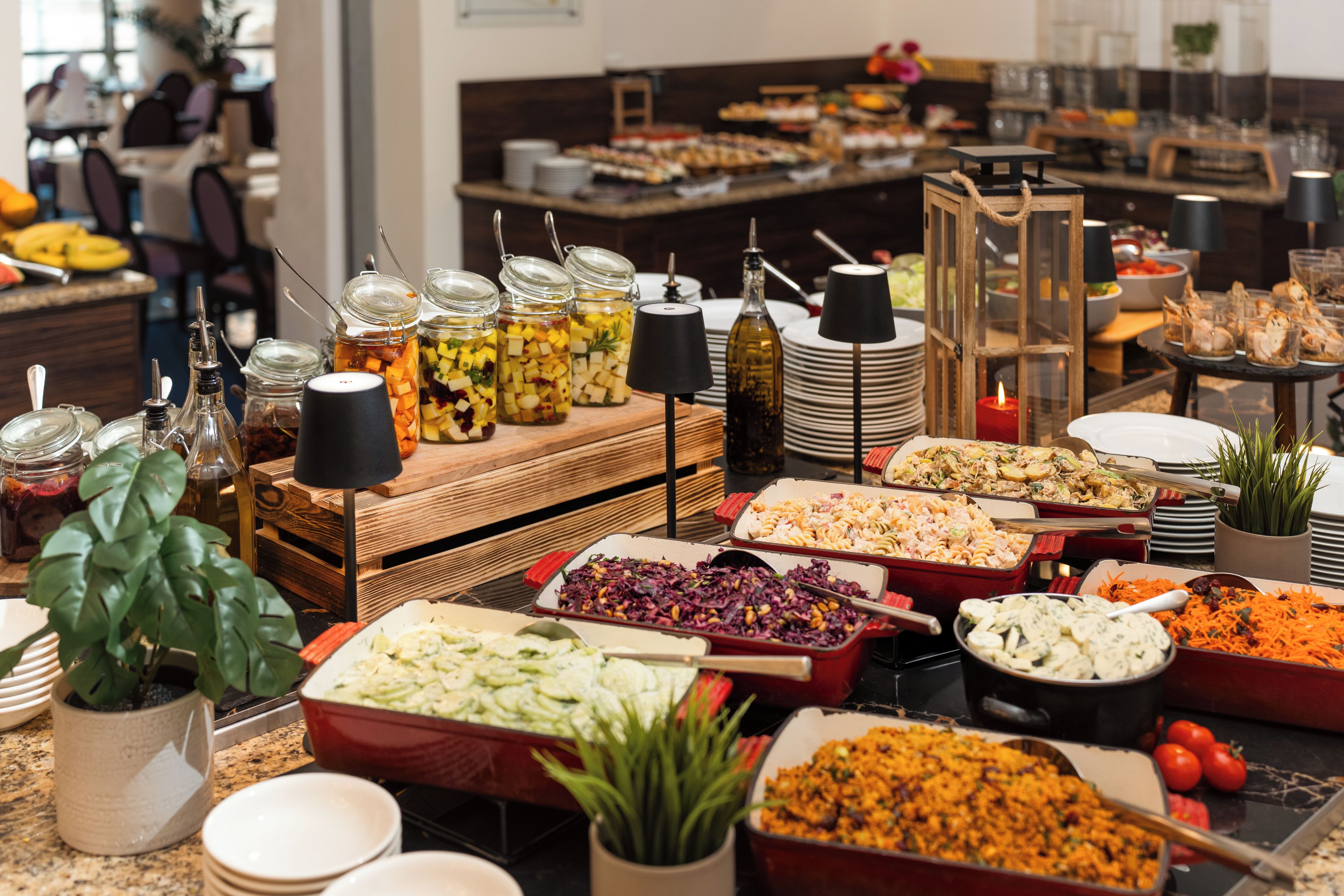 A buffet with various food items and condiments.
