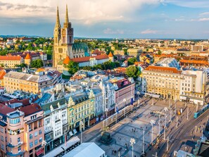 A historic cityscape with a prominent cathedral, a bustling square, and traditional architecture. - Studio mitten im Zentrum von Zagreb by Interhome (Zagreb)