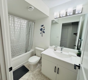 Shower, towels, soap, toilet paper