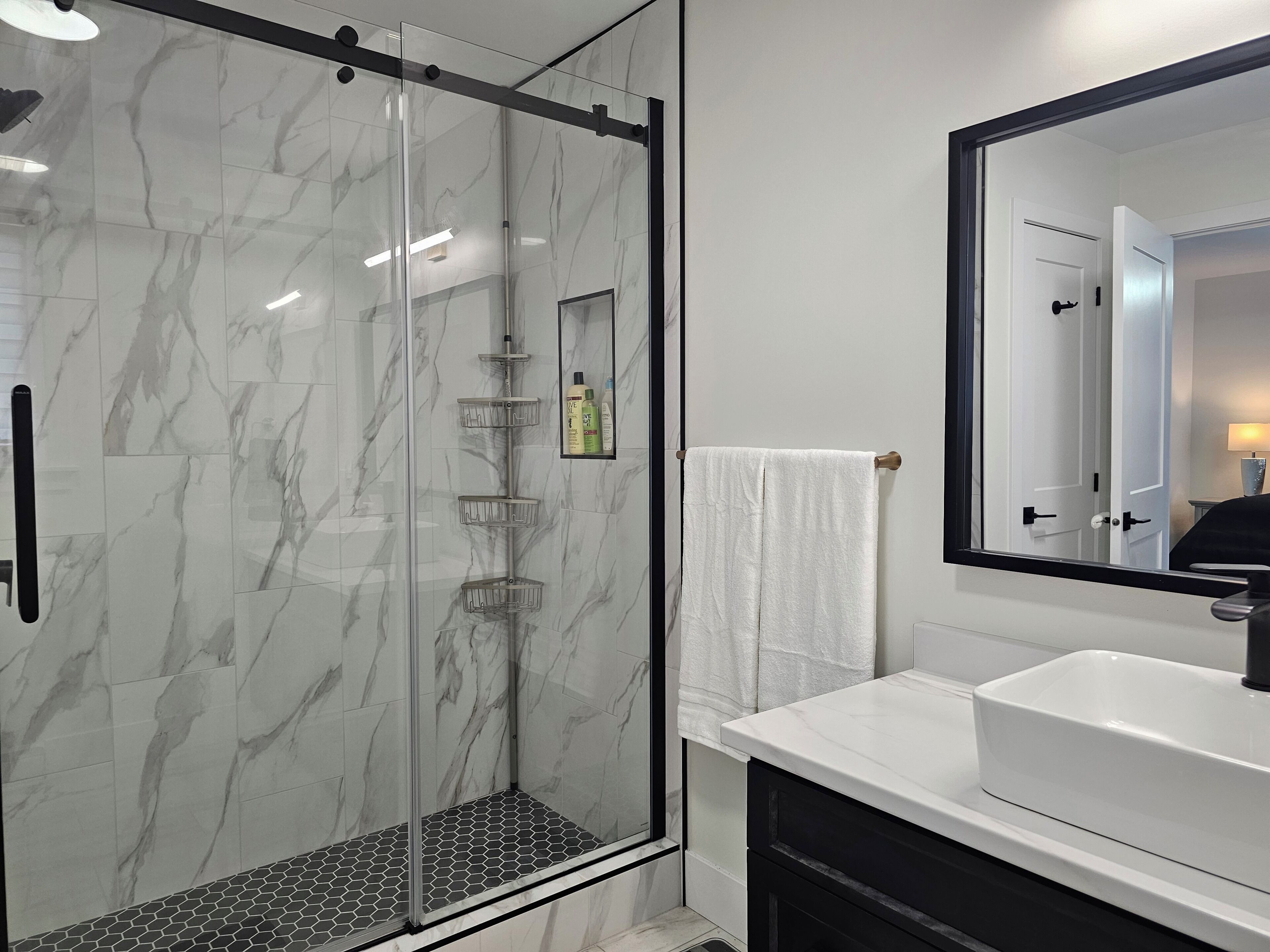 Shower, hair dryer, towels, soap