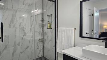 Shower, hair dryer, towels, soap