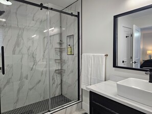 Shower, hair dryer, towels, soap