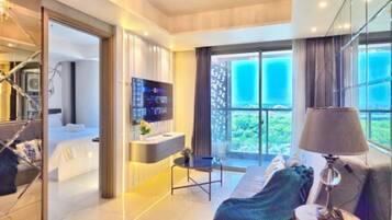 Apartment, 3 Bedrooms, City View | Living area | 43-inch Smart TV with cable channels