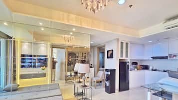 Apartment, 3 Bedrooms, City View | Living area | 43-inch Smart TV with cable channels
