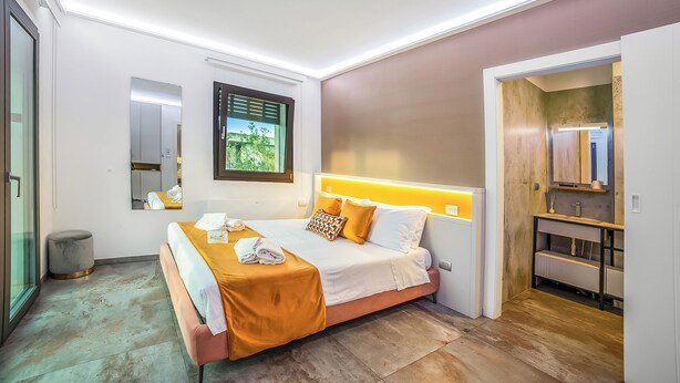 A modern hotel room with a bed, bedside table, and a view of the outdoors. - Alternative Room 3 Relax & SPA, Scorrano, Italy (Scorrano)