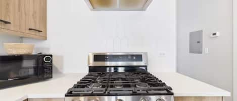 Coffee/tea maker, fridge, microwave, oven