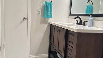 Hair dryer, towels, soap, shampoo