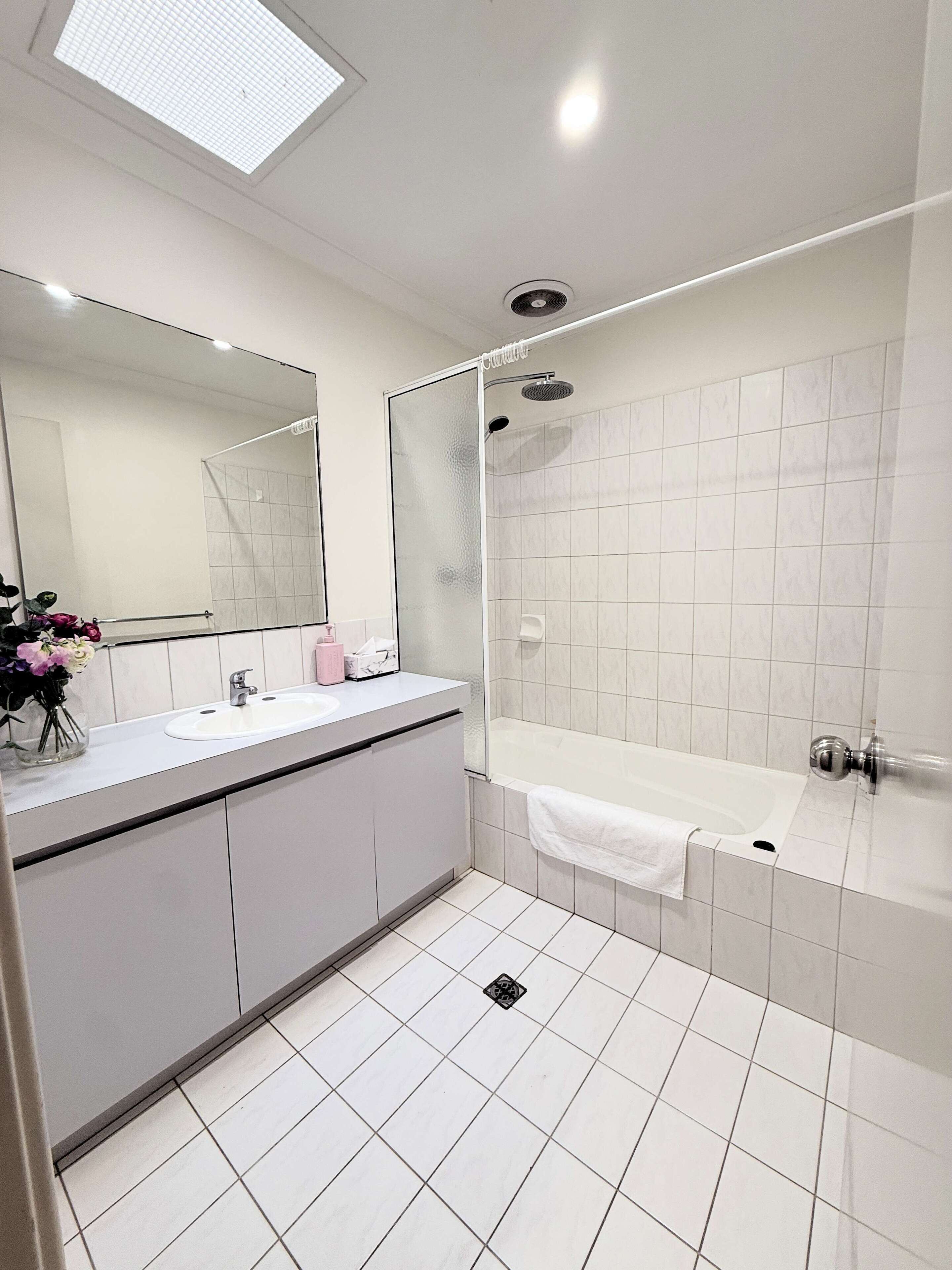 Shower, hair dryer, towels, shampoo