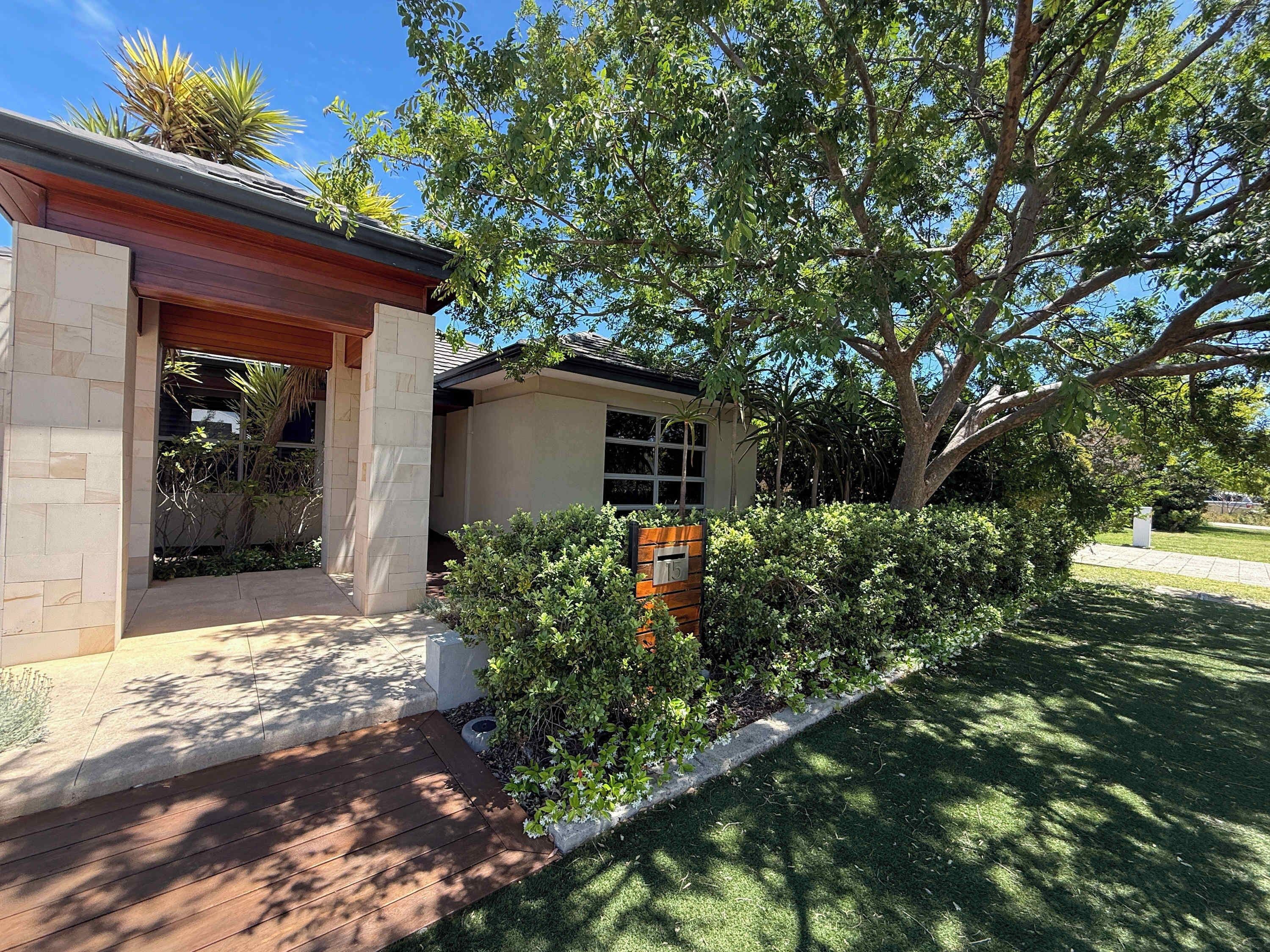 Experience private luxury in this stunning home featuring beautiful stone pillars, a warm timber entryway, and a mature garden sanctuary. The perfect spot for a stylish and relaxing vacation.