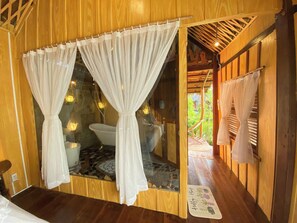 Deluxe Room | Bathroom | Rainfall showerhead, free toiletries, hair dryer, towels - Mekong Silt Ecolodge  (Can Tho)