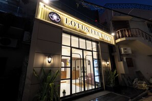 A building with a sign reading 'LOTUS FEELIN' and a visible entrance. - Lotus Feet Inn (Varanasi)