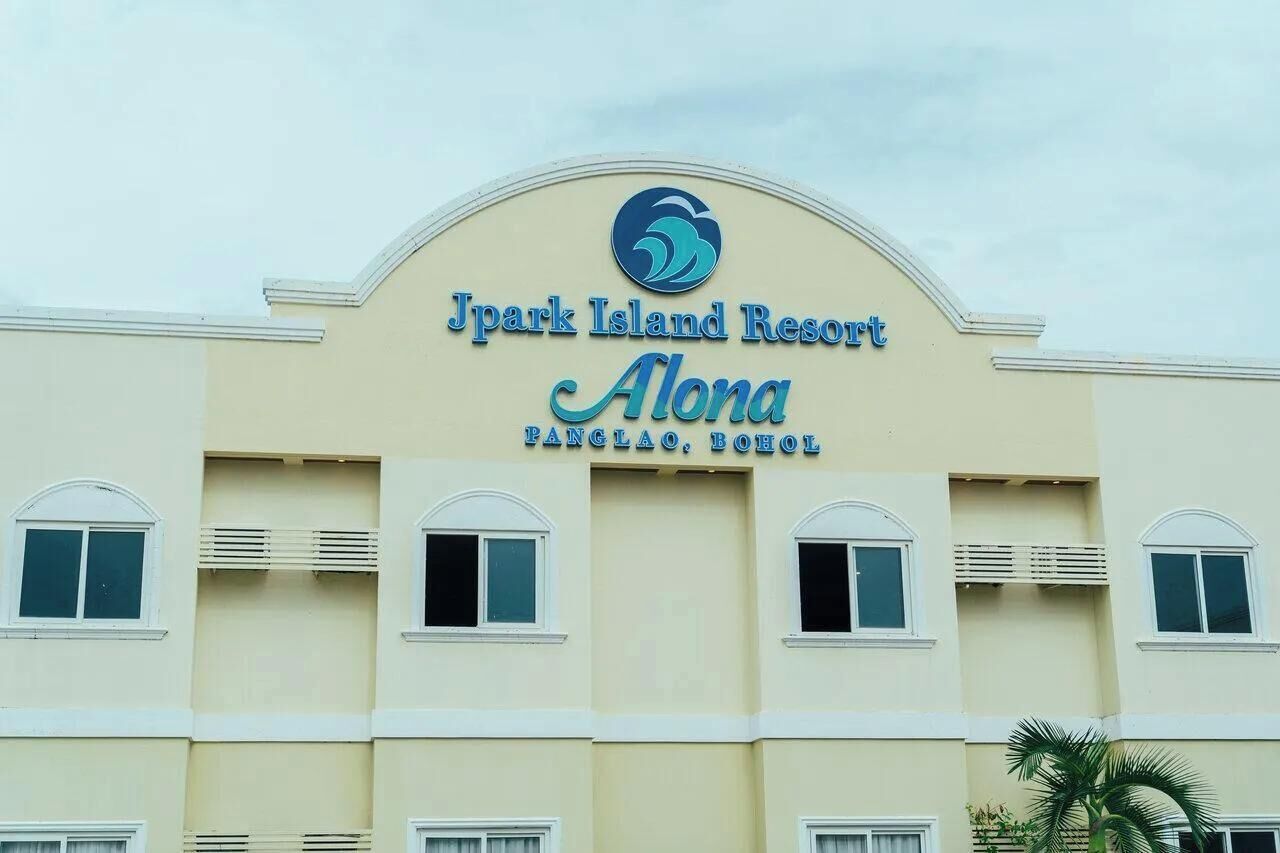 A building with a sign reading 'Jpark Island Resort Alona Pangalao, Bohol.'