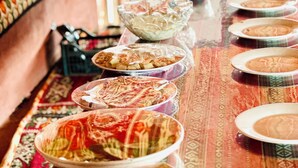 A long table with various dishes, possibly for a meal or event.