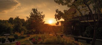 Wooden house in nature with balcony, animals & peaceful surroundings