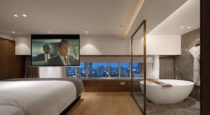 A modern hotel room with a large bed, a bathtub, a TV mounted on the wall, and a city view. - SEYA Serviced Apartment - Chengdu Taikoo Li Flagship - Managed by SEYA GROUP (Chengdu)