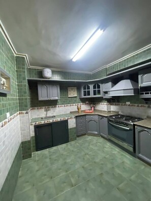 Fridge, microwave, oven, cookware/dishes/utensils - Spacious 3-Bedroom Apartment with balcony in Abbas el akkad with City View (Cairo Governorate)