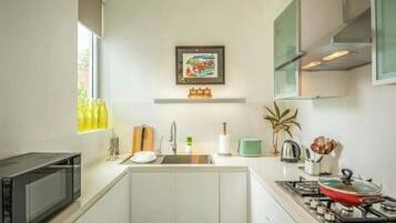 Fridge, microwave, stovetop, coffee/tea maker