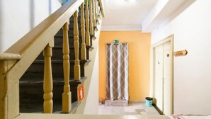 A staircase with wooden balusters leading to a landing. - Hostel Martin (Koper)