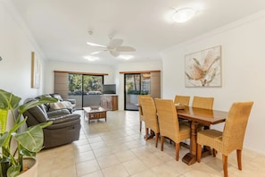 Three Bedroom Ocean View Apt Ground Floor | Living area | 32-inch flat-screen TV with satellite channels, Netflix - The Breakers Yamba (Yamba)