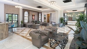A spacious lobby with a marble floor, leather sofas, a reception desk, and a chandelier. - Casa dell'Eleganza Event Hall & Hotel (Kranevo)